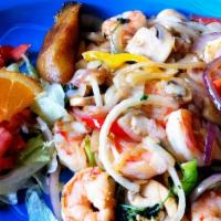 Arroz Con Camarones · Sauteed shrimp, onions, green peppers, and mushrooms. Served on a bed of rice topped with me...
