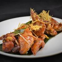 Peek Kai * ปีกไก่ทอด · Signature wing chicken wings marinated in fish sauce, deep fried, tossed in caramelized garl...