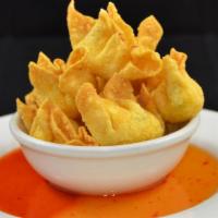 Crab Ranggoon: · Golden-fried wonton skin wrapped w/crab meat, basil leaves, and cream cheese, served w/spicy...