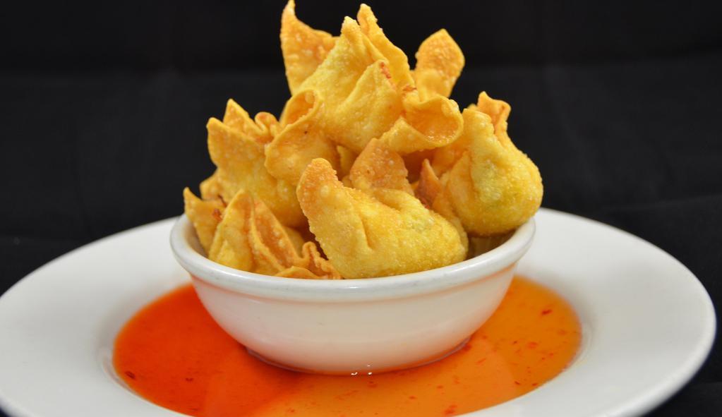 Crab Ranggoon: · Golden-fried wonton skin wrapped w/crab meat, basil leaves, and cream cheese, served w/spicy homemade sauce.
