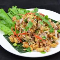 Nam Kao Tod* (Crispy Rice & Pork Salad) · Crispy curry rice tossed with pork sausage, lime sauce, ginger, roasted chili, peanuts, onio...