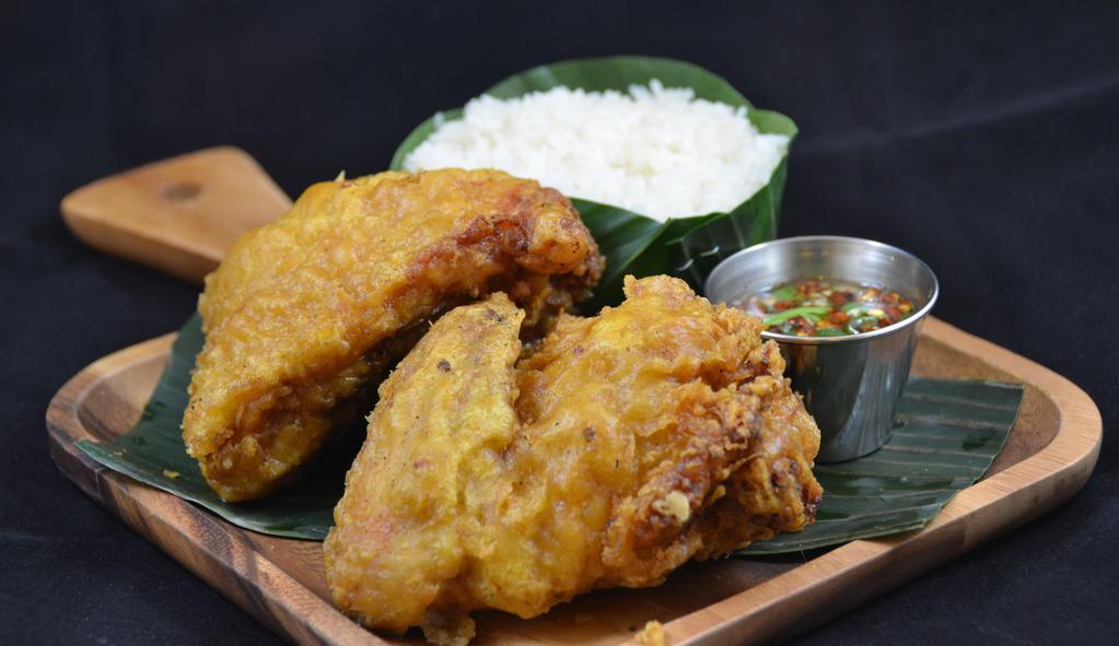 1/2 Fried Chicken · Kai Todd: (Fried Chicken)
Our signature northern style marinated chicken, sticky rice & curry sauce.