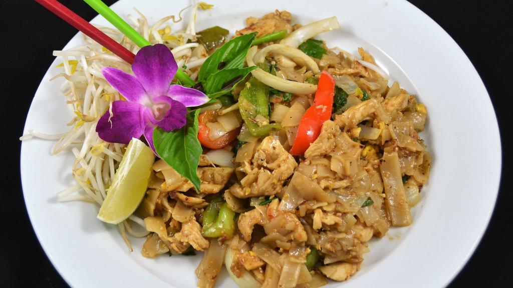 Pad Kee Mao:* · Pan-fried wide-size rice noodles with egg, onions, green onions, bell peppers, fresh chili, fresh garlic, and basil leaves.
