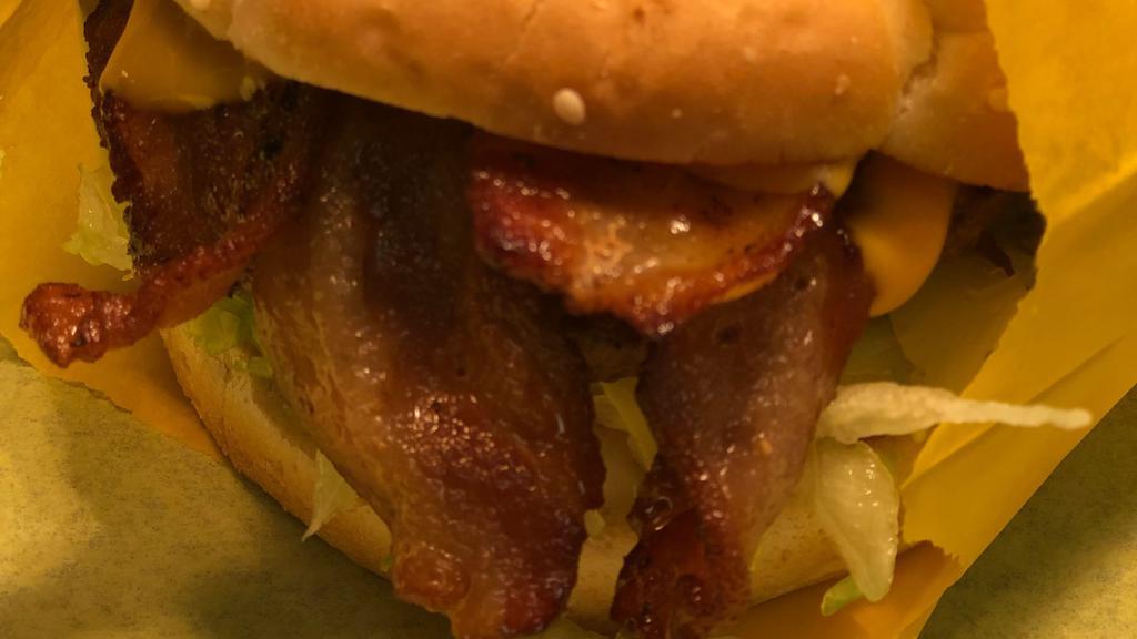 Bacon Cheeseburger · Hamburger Patty, bacon, american cheese, lettuce, onions, tomato and fry sauce dressing.
