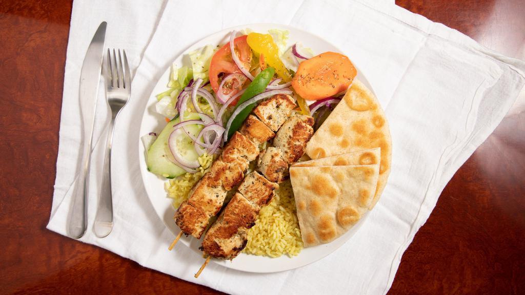 Chicken Souvlaki Platter · two skewers of chicken with french fries or rice pilaf, pita bread, side salad and drink.