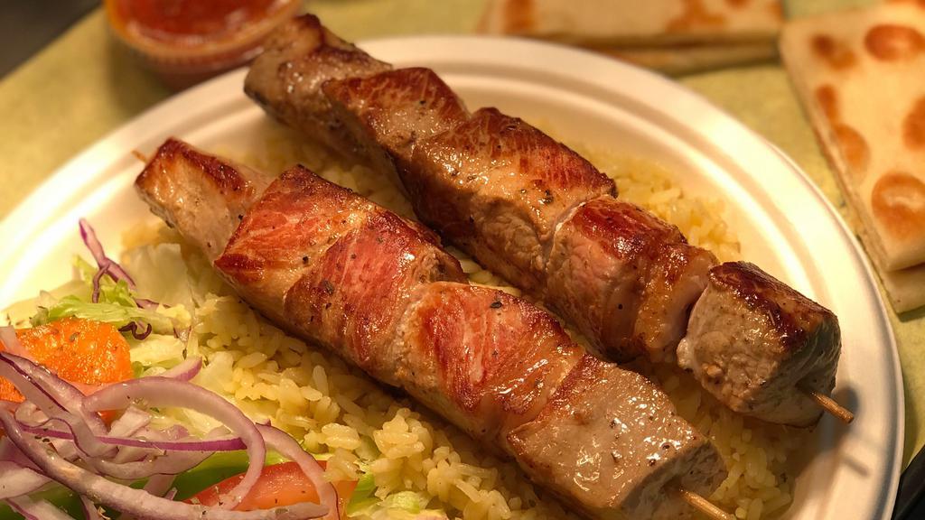 Pork Souvlaki Platter · two skewers of pork with french fries or rice pilaf, pita bread, side salad and drink.