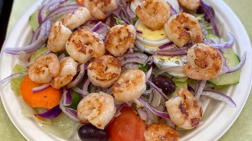 Shrimp Greek Salad · 12 Pc. Shrimp, Lettuce, tomatoes, cucumber, kalamata olives, carrots, pepperoncini, bell peppers, boiled egg, thinly sliced red onion, feta cheese, dried oregano, garlic bread and extra-virgin olive oil.