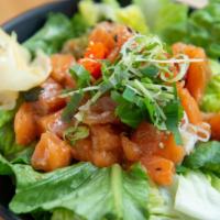 Salmon Poke Bowl · Lettuce, seaweed, sesame seeds, mixed-herbs, onion, masago, sesame-soy sauce.