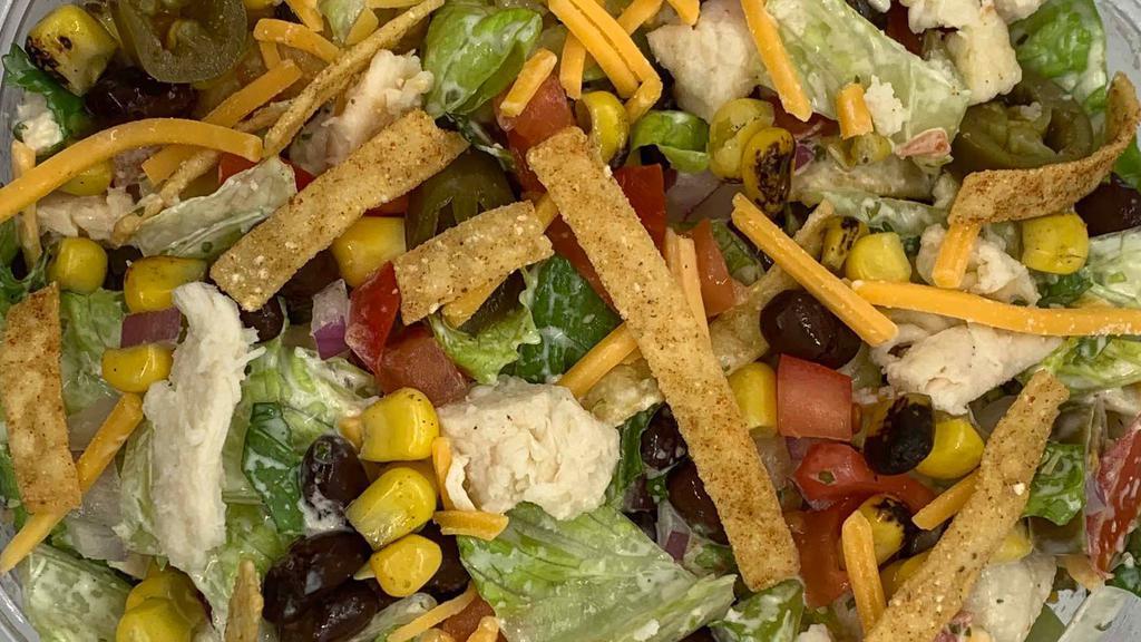 Southwest Salad · Made with our  Chop Chop Mix of Greens, Chipotle LIme Chicken or Tofu, tomato, roasted corn, red onion, jalapeños, cilantro, black beans, cheddar cheese, tortilla strips and tossed in our house made Cilantro Lime dressing.