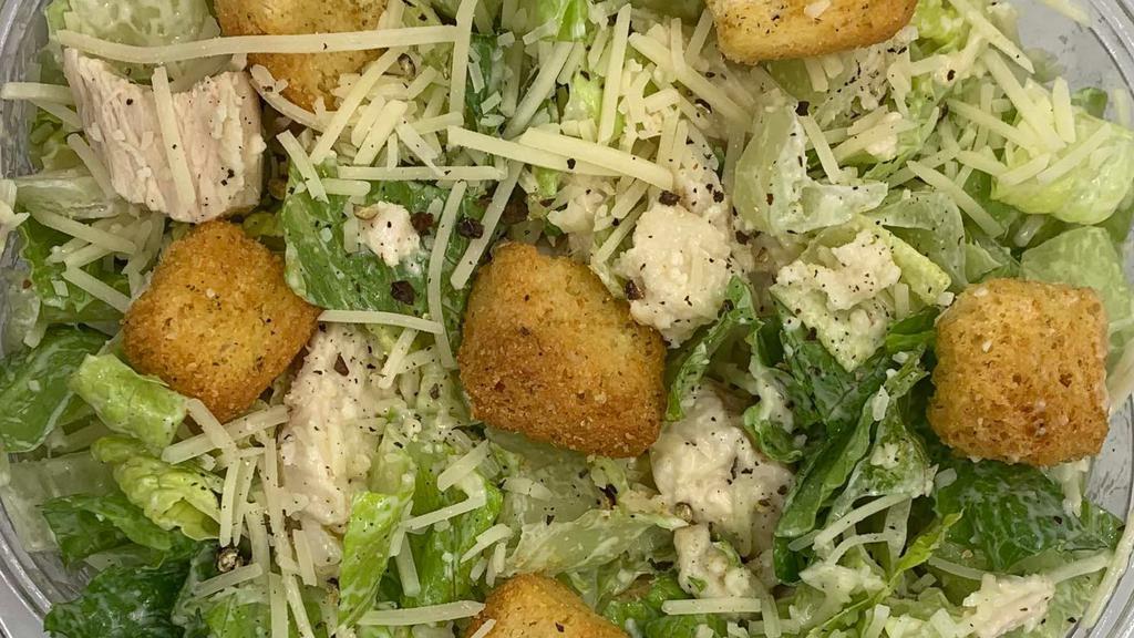 Classic Caesar Salad · Made with Romaine lettuce, Roasted Chicken or Seasoned Tofu, fresh cracked Black Pepper, Shaved Parmesan, Croutons and our house made Caesar dressing.