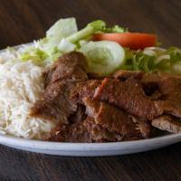 Gyros Plate · Lamb and beef seasoned with Greek spices, cooked on a spit. Served with rice and tossed gard...