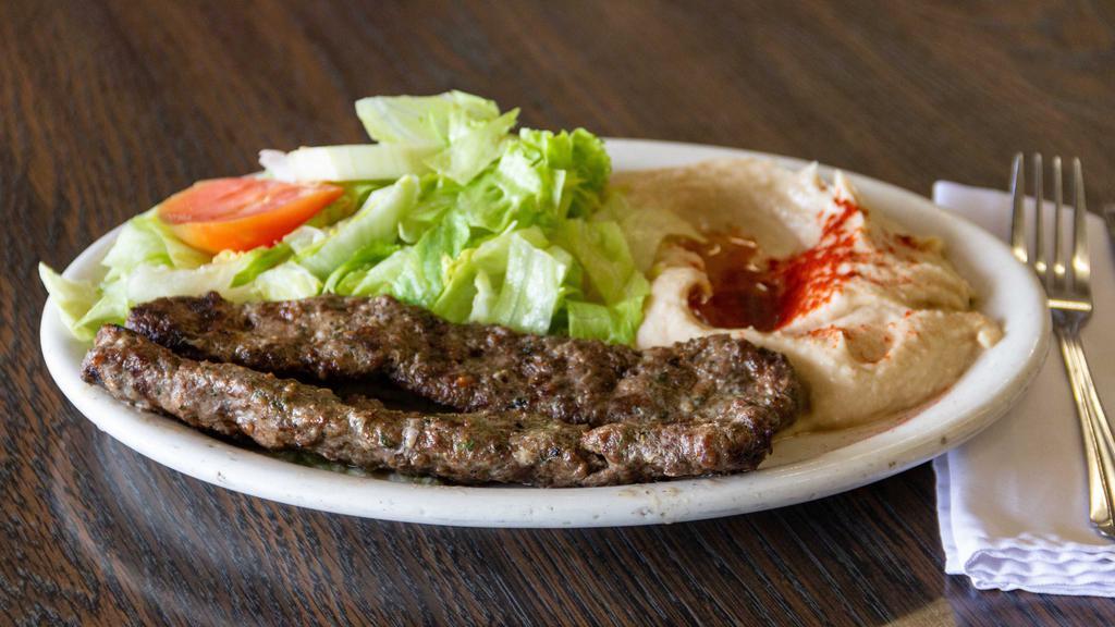 Kafta Plate · Grilled mixture of ground beef, chopped onion, parsley, and spices. Served with hummus and salad.