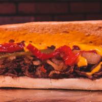 Sweet Pepper Cheesesteak · Sliced ribeye steak, melted nacho cheese, grilled onions, roasted peppers, on a hoagie roll.