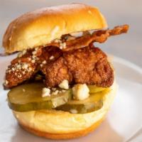 Buffalo Chicken · Hand-breaded, sweet buffalo, candied bacon, bleu cheese, grilled onion, pickles.