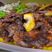 Meat Shawarma Plate · USD beef marinated and lamb cooked on a slowly revolving rotisserie served with hummus, sala...