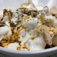 Manti, Beef Dumplings · Small beef dumplings boiled to reflection. Garlic yogurt sauce, pan fried butter and spices ...