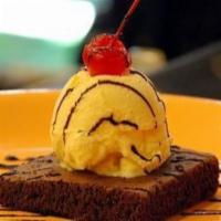 Brownie A La Mode · Chocolate brownie topped with ice cream whipped cream an chocolate sauce.