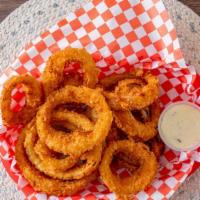 Onion Rings (12Pc) · Freshly Hand Cut onion rings battered in our special flour and mixture fried crisply