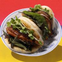Pork Bun (2Pc) · Fluffy bun filled with sweet and tangy pork.