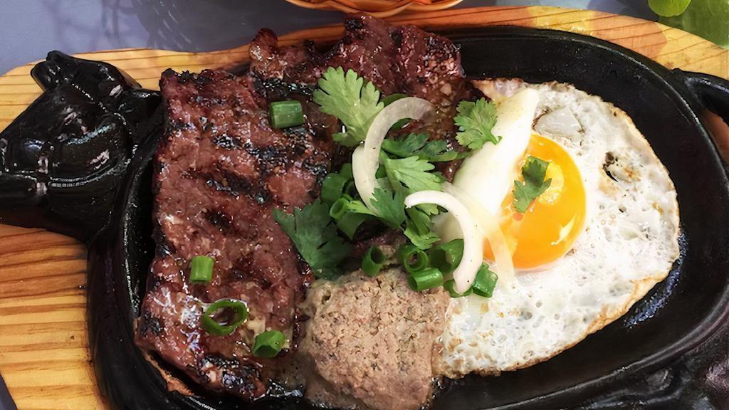 Bo Ne (Pate, Steak And Egg) · Banh mi with steak pate and egg.
