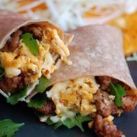 Breakfast Burrito · Our large burrito weighs more than a pound and is filled with rice, beans, 2 scrambled eggs,...