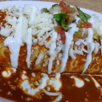 Burrito Mojado · Our large burrito weighing up to a pound or more is filled with rice, beans, pico de gallo a...