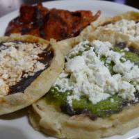 Picadita (Single One) · Each thick hand-made tortilla is topped with black beans, fresh Mexican cheese, and onions. ...