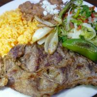 Carne Asada · Thinly sliced steak is marinated Oaxacan style. It comes with rice, beans, pico de gallo, a ...