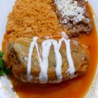 Chile Relleno · The poblano pepper is stuffed with Mexican fresh cheese and coated in a fried egg. The peppe...