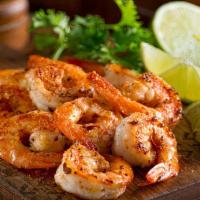 Camarones Al Mojo De Ajo · Shrimps are marinated and seasoned with garlic served with rice, beans, and two hand-made to...