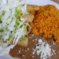 1Ord Tacos Dorados · Fried crispy golden tacos filled with chicken topped fresh Mexican cheese, sour cream and is...