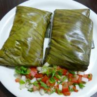 Tamales Oaxaqueños · Banana leaf tamales are filled with chicken in either red or green salsa. Pork-rib bone tama...