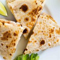 Kid'S Quesadilla · Flour tortilla folded and filled with cheese and side of sour cream  with your choice of mea...