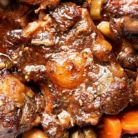 Nola Oxtails  · Includes Yellow Rice /White Beans