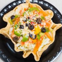 Taco Salad · Deep fried flour tortilla shell filled with your choice of chicken or beef then layered with...