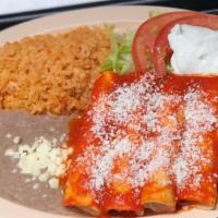 Enchiladas Suizas · Authentic enchiladas with filling prepared with sauce of fresh mexican tomatillos, green pep...