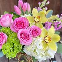 I Got You! · A lush arrangement of pinks, whites and soft green including roses, hydrangea, tulips, cymbi...