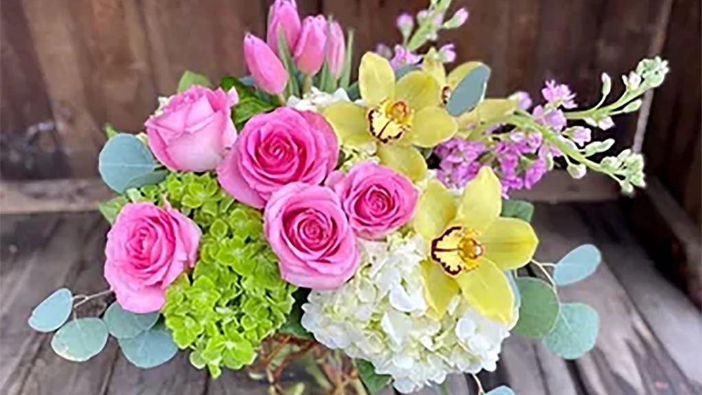 I Got You! · A lush arrangement of pinks, whites and soft green including roses, hydrangea, tulips, cymbidium orchids and fragrant hyacinth
photo is of better version. Approx. 18h x 13w local delivery only.