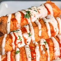 Buffalo Rolls · Chicken, wing sauce, pepper jack and fried egg roll.