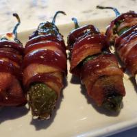 Texas Twinkies · Roasted jalapeno peppers, stuffed with cream cheese, wrapped in bacon and drizzled with Bbq ...
