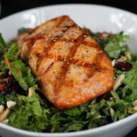 Salmon Kale Salad · Spinach, kale, salmon, dried cranberries, chia seeds, almonds and balsamic vinaigrette. Glut...