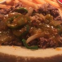 Green Chili Philly Cheesesteak · Shaved beef, cheddar-jack, grilled onion, grilled jalapeno, green chili, side of queso and F...