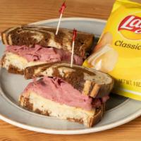 The Conductor Sandwich · Corned beef, sauerkraut, Swiss, and pepper gourmaise toasted on rye. Sandwich is made from b...