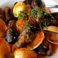 Cozze E Vongole Al Vino · Mussels and clams, in a garlic butter white wine sauce, and parsley.