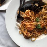 Linguini Ai Frutti Di Mare · Mussels, clams, shrimp, and calamari in a light tomato sauce, with chili flakes, garlic and ...