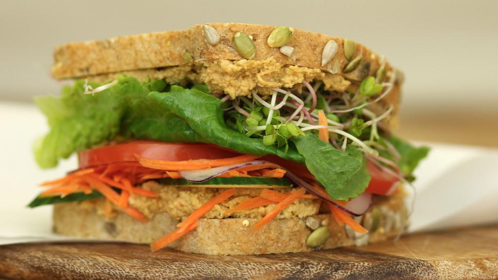 3 Seed Hummus Vegetarian · Roasted sesame, sunflower, and pumpkin seeds pu réed with chickpeas in a healthy, protein packed hummus spread on Dakota bread with radish sprouts, carrots, tomatoes and lettuce. 520 cal. per serving.