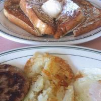 The Palace Feast · Two eggs, pancakes or French toast or a biscuit with country gravy or a petite waffle, fresh...