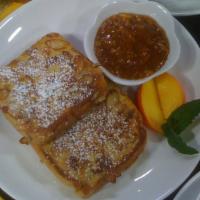 Almond French Toast · Three slices grilled and served with our apple butter or blueberry or strawberry compote.