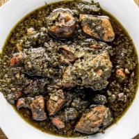 Ghormeh Sabzi · Fragrant stew of herbs, beef and kidney beans, seasoned with dried limes and onions.