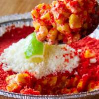 Elote · creamy Mexican street corn topped with hot Cheetos, cotija cheese & lime.